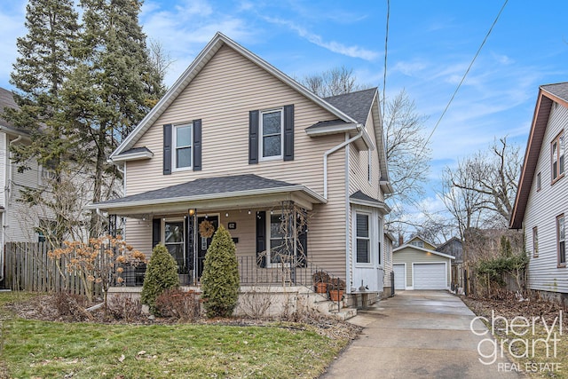 view of front of home featuring a detached garage, an outbuilding, fence, a porch, and a front yard