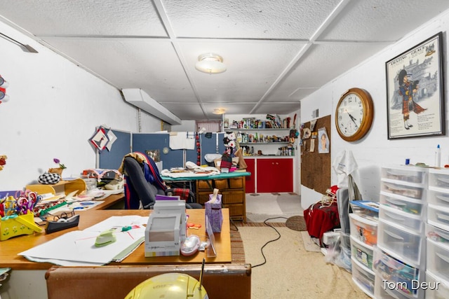 carpeted office with a workshop area