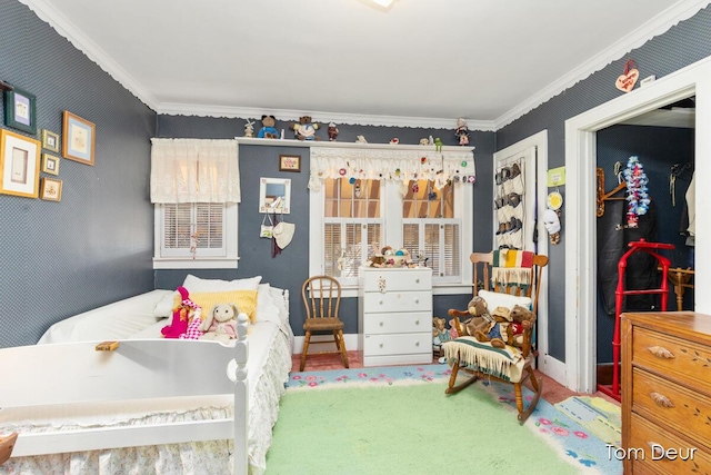 bedroom featuring wallpapered walls, carpet, and ornamental molding