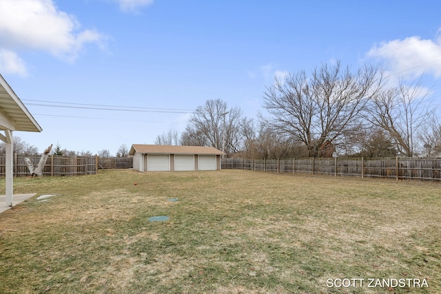 view of yard with a fenced backyard and an outdoor structure