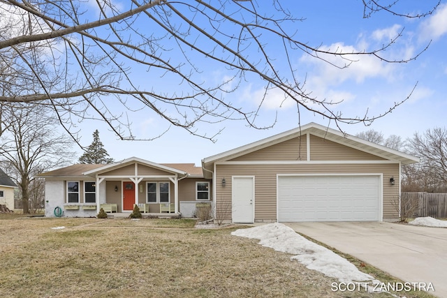 ranch-style home with a front lawn, concrete driveway, fence, and an attached garage