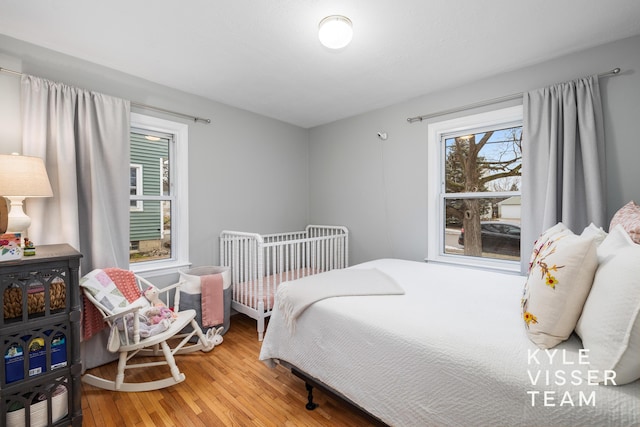 bedroom with wood finished floors