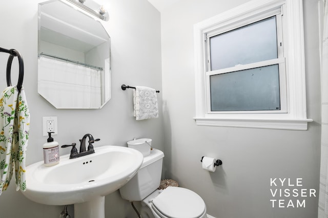 full bath featuring a sink and toilet