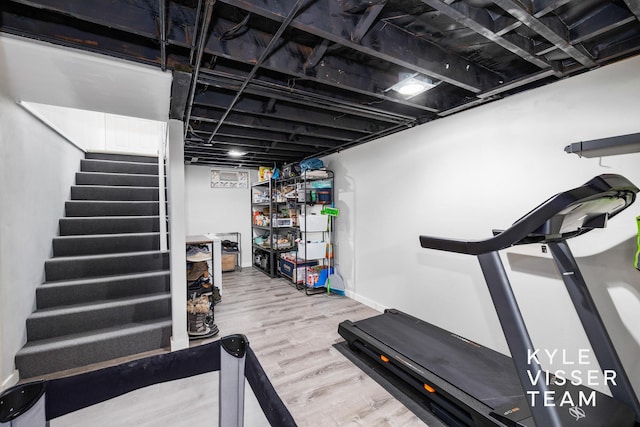 workout area featuring wood finished floors