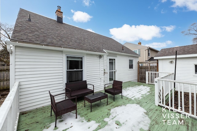 back of property featuring a chimney, a shingled roof, fence, an outdoor living space, and a wooden deck