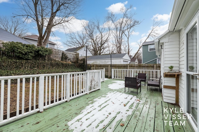 wooden deck featuring a fenced backyard