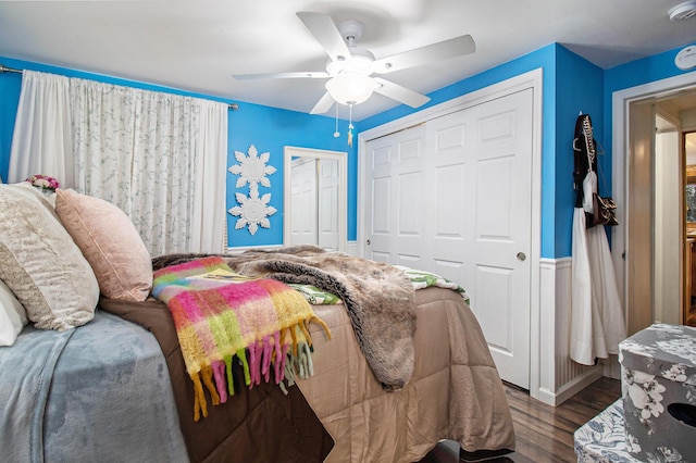 bedroom featuring a ceiling fan, a closet, and wood finished floors