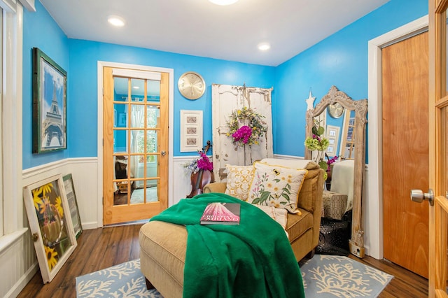 bedroom featuring recessed lighting, wainscoting, and wood finished floors