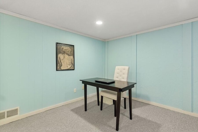 carpeted office featuring baseboards, visible vents, and ornamental molding