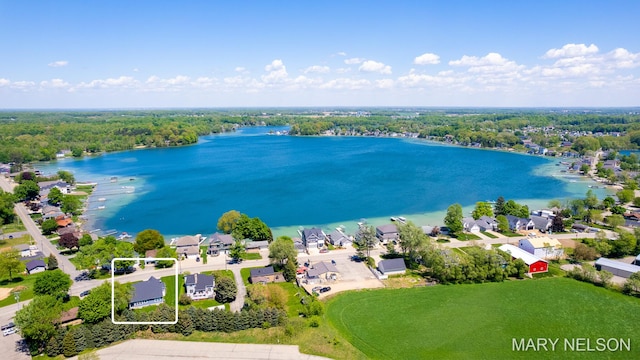 drone / aerial view with a residential view and a water view