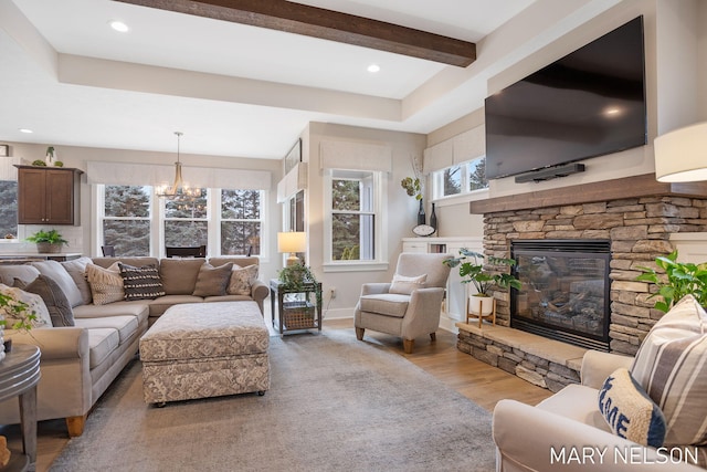 living room with baseboards, a chandelier, recessed lighting, a fireplace, and wood finished floors