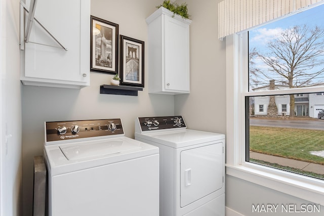 laundry area featuring cabinet space and independent washer and dryer