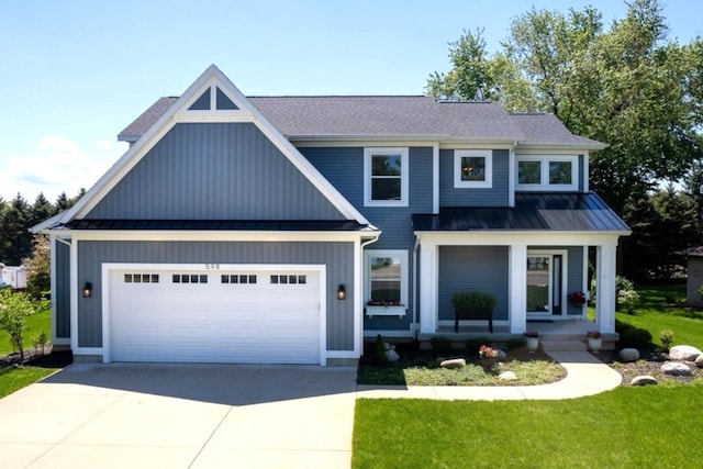 view of front of house featuring driveway, a standing seam roof, an attached garage, covered porch, and metal roof