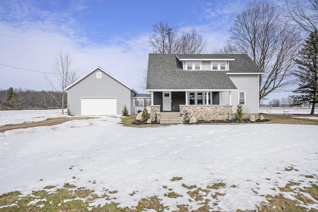 view of front facade featuring a garage, covered porch, and an outdoor structure