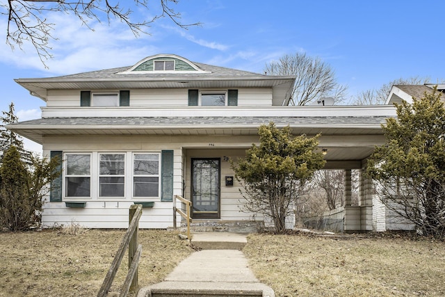 view of front of house featuring roof with shingles