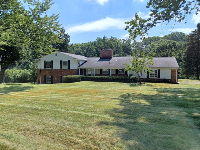 4265 Pine Tree Trl, Bloomfield Hills, MI 48302 - tri-level home with brick siding, a chimney, and a front lawn