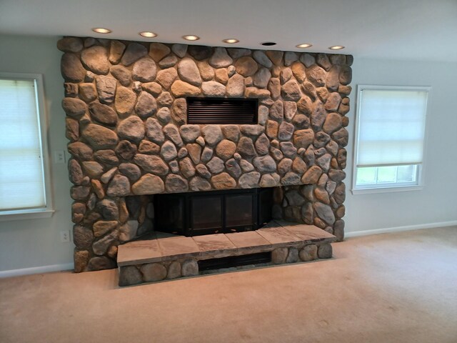 4265 Pine Tree Trl, Bloomfield Hills, MI 48302 - details with visible vents, a fireplace, baseboards, and carpet floors