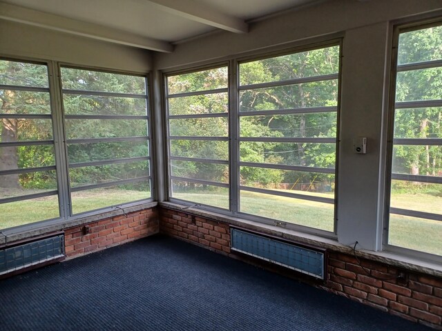 4265 Pine Tree Trl, Bloomfield Hills, MI 48302 - unfurnished sunroom featuring beam ceiling and plenty of natural light