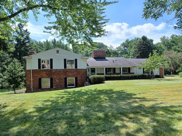 4265 Pine Tree Trl, Bloomfield Hills, MI 48302 - tri-level home with a front lawn, brick siding, and a chimney