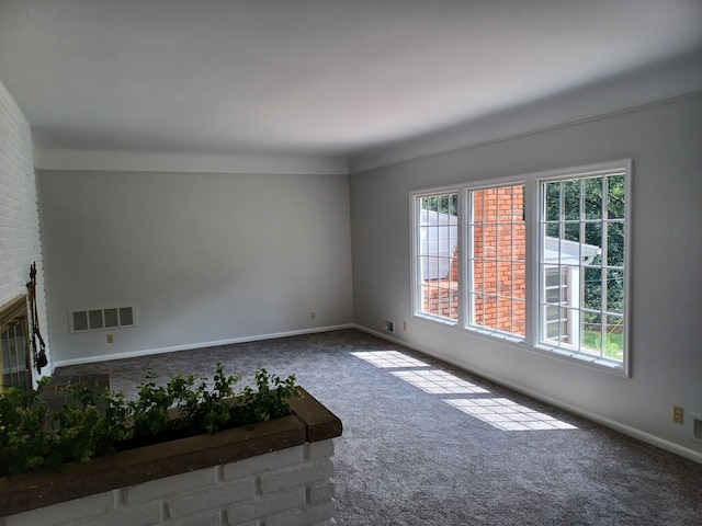 4265 Pine Tree Trl, Bloomfield Hills, MI 48302 - unfurnished living room featuring visible vents, carpet flooring, baseboards, and a healthy amount of sunlight