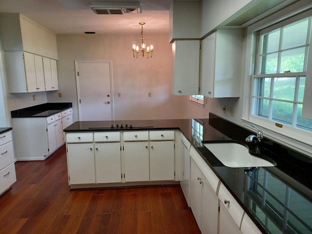 4265 Pine Tree Trl, Bloomfield Hills, MI 48302 - kitchen with a sink, dark countertops, dark wood-style floors, a peninsula, and white cabinets