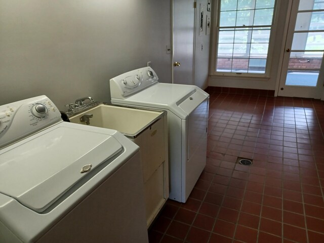 4265 Pine Tree Trl, Bloomfield Hills, MI 48302 - laundry room featuring dark tile patterned floors, washing machine and dryer, and laundry area