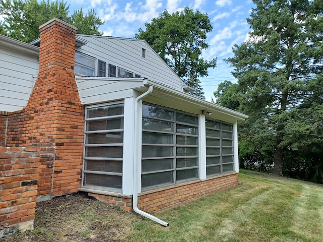 4265 Pine Tree Trl, Bloomfield Hills, MI 48302 - view of home's exterior featuring a chimney and a yard
