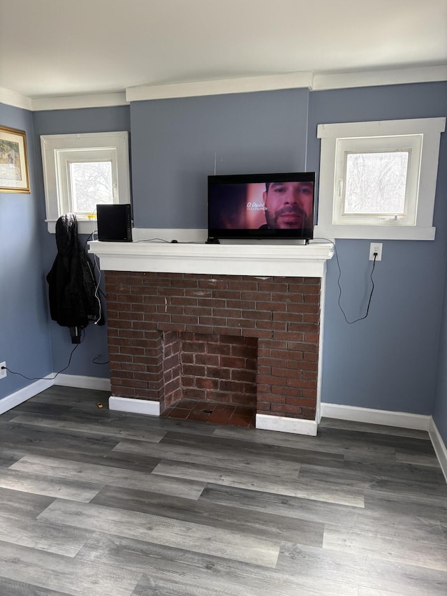 living area featuring wood finished floors and baseboards