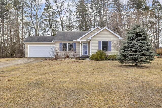 ranch-style home featuring driveway, brick siding, an attached garage, and a front yard