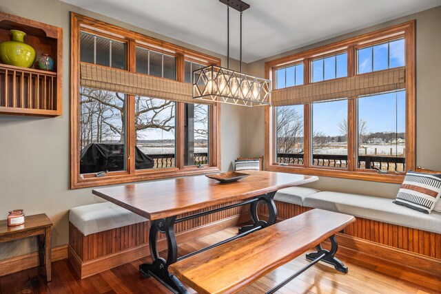 14788 Boom Rd, Spring Lake, MI 49456 - dining space with a chandelier, breakfast area, and wood finished floors