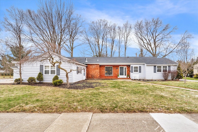 single story home with a front lawn and brick siding