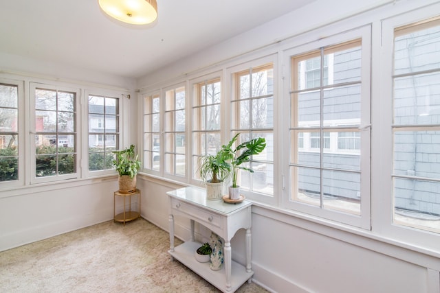 sunroom / solarium featuring a healthy amount of sunlight