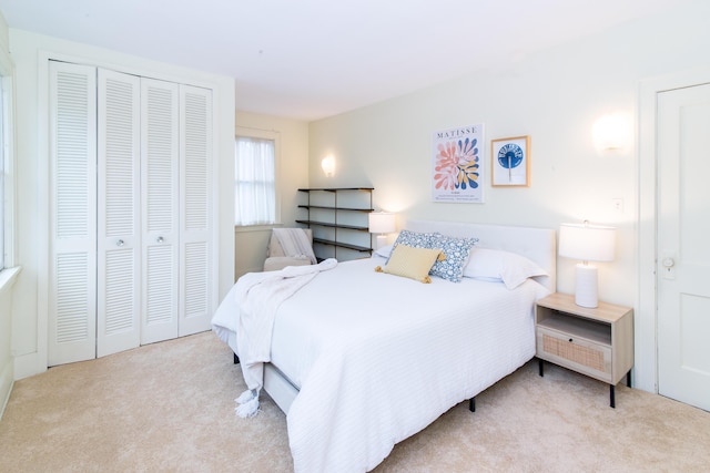 carpeted bedroom with a closet