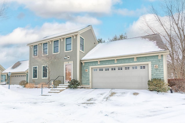 colonial home featuring an attached garage