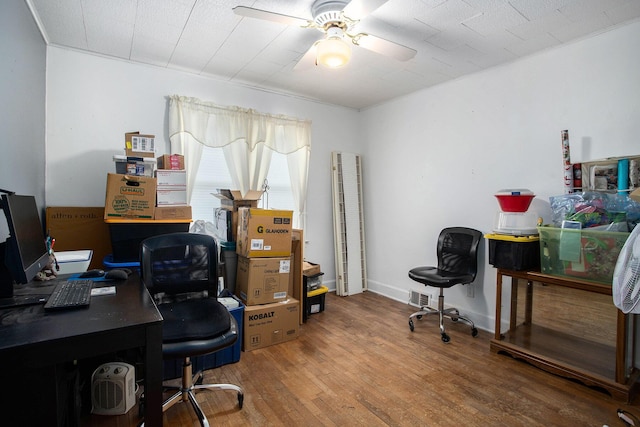 office area with ceiling fan, baseboards, and wood finished floors