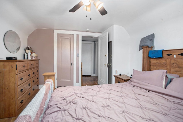 bedroom with a ceiling fan and lofted ceiling