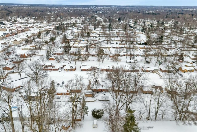 snowy aerial view with a residential view