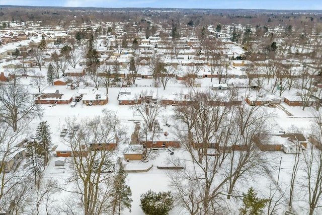 snowy aerial view featuring a residential view