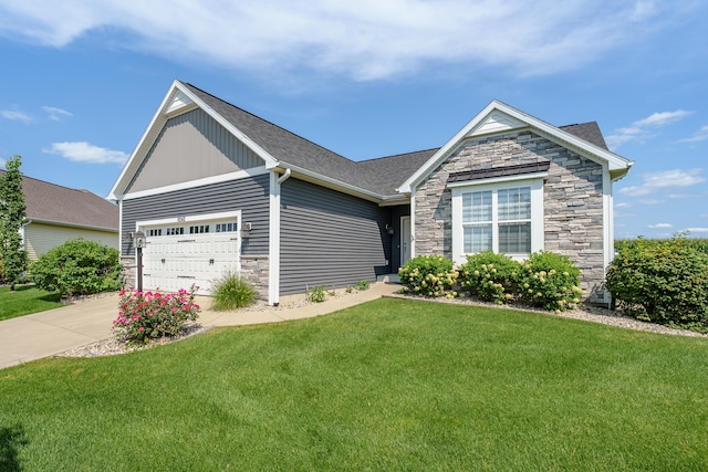 view of front of home featuring roof with shingles, concrete driveway, an attached garage, stone siding, and a front lawn