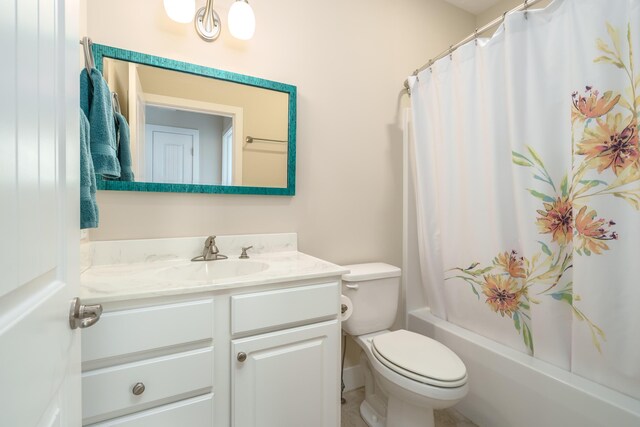 full bathroom featuring shower / bath combo, vanity, and toilet