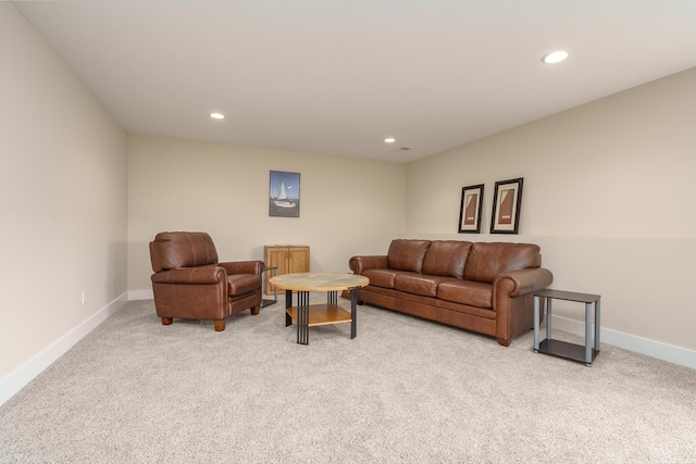 living area featuring recessed lighting, light colored carpet, and baseboards