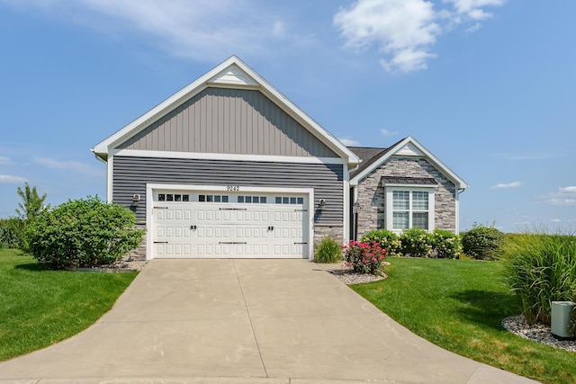 view of front facade with driveway, stone siding, an attached garage, a front lawn, and board and batten siding