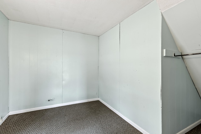 spare room with carpet and baseboards