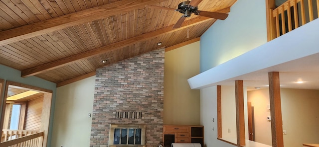 unfurnished living room with wood ceiling, a brick fireplace, vaulted ceiling with beams, and ceiling fan