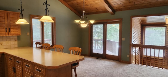 dining room featuring wood ceiling, light colored carpet, vaulted ceiling with beams, and a healthy amount of sunlight