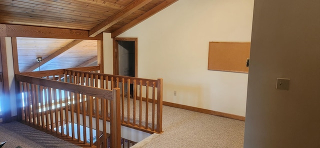 stairs featuring vaulted ceiling with beams, wooden ceiling, baseboards, and carpet flooring