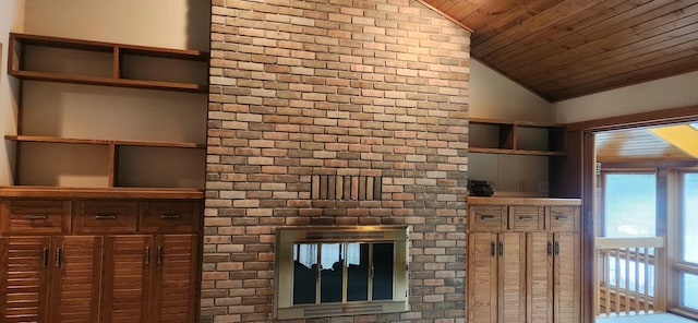 unfurnished living room featuring lofted ceiling, wooden ceiling, and a brick fireplace