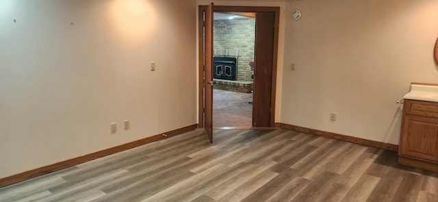 interior space with light wood-type flooring and baseboards