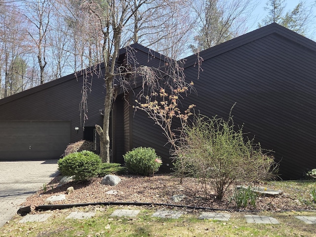 3075 Mineral Springs Trl, Mount Pleasant, MI 48858 - view of side of property with a garage