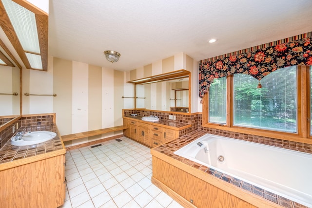 3075 Mineral Springs Trl, Mount Pleasant, MI 48858 - bathroom featuring a jetted tub, wallpapered walls, vanity, tile patterned flooring, and recessed lighting